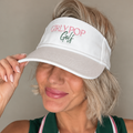 girl wearing white visor