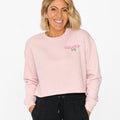 Woman wearing a pink sweatshirt with 'Girlgop' logo on a white background