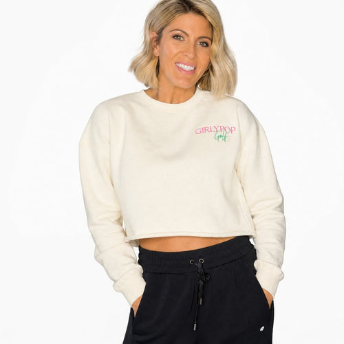 Woman wearing a cream sweatshirt with text on a white background