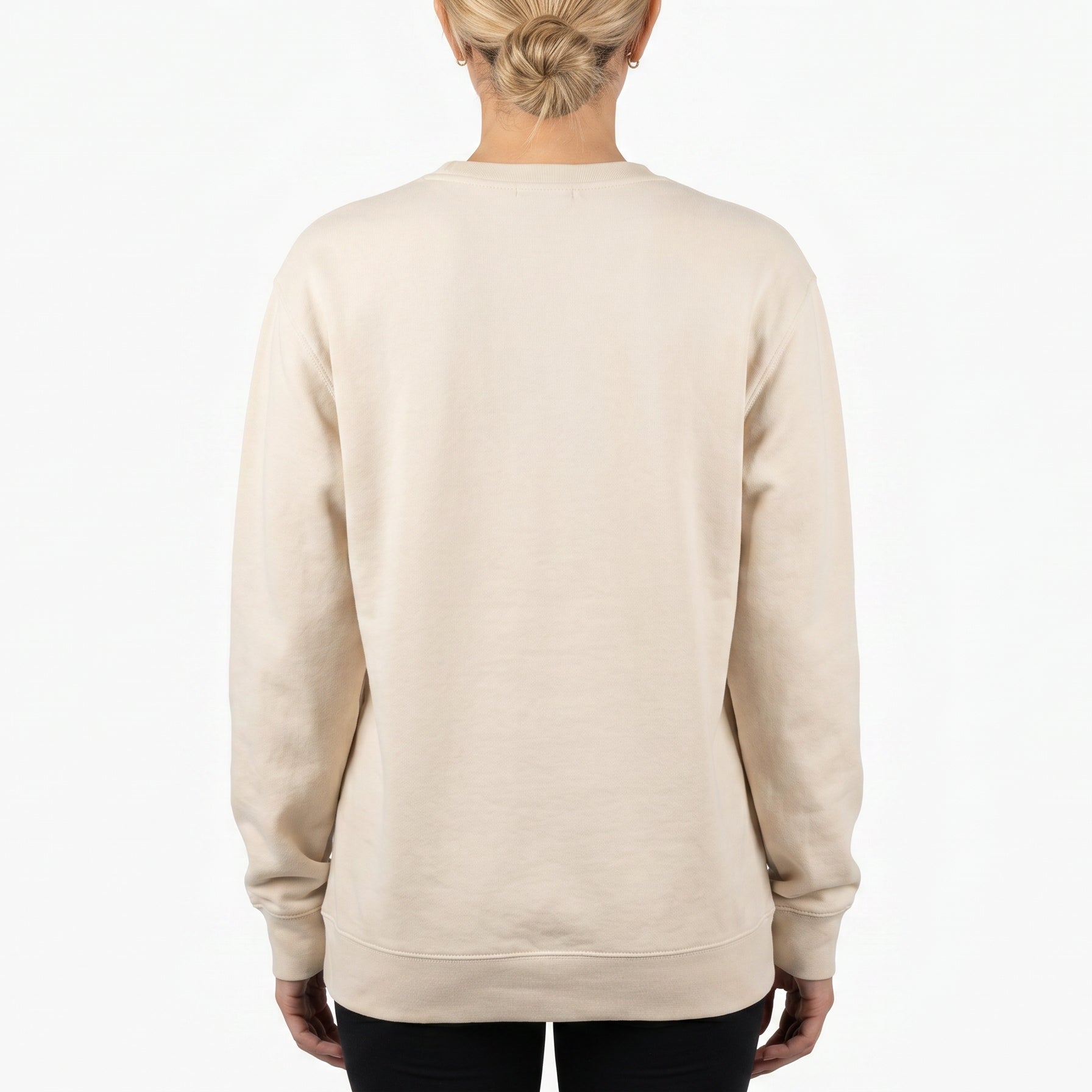 Person wearing a beige sweatshirt on a white background