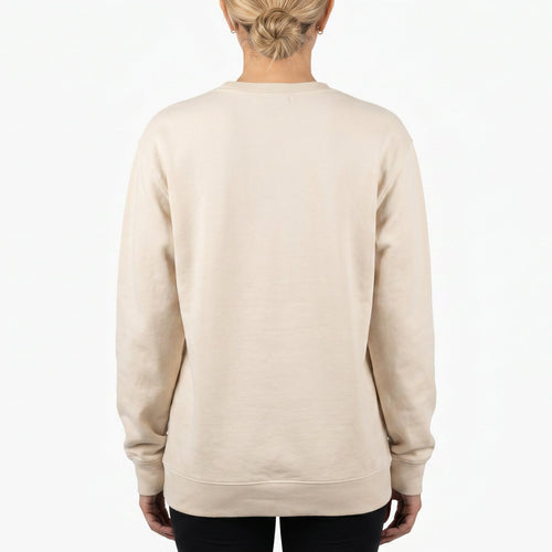 Person wearing a beige sweatshirt on a white background